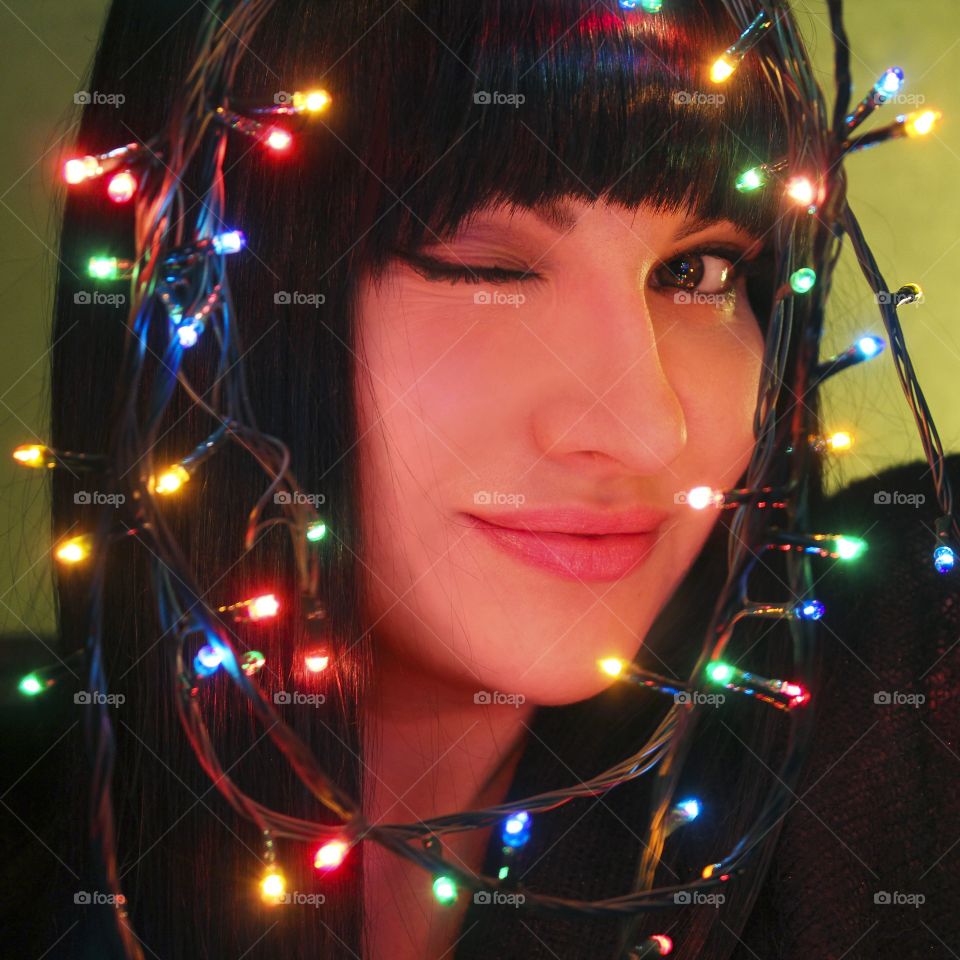 Christmas lights smiling girl 
