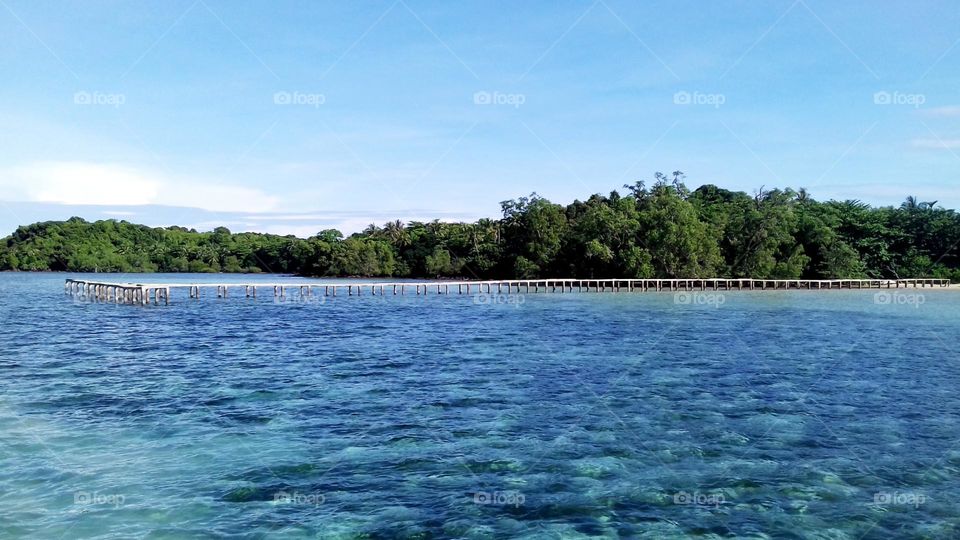 Pier in a coastal village. Natural landscape photos for various websites, backgrounds, desktops and more.