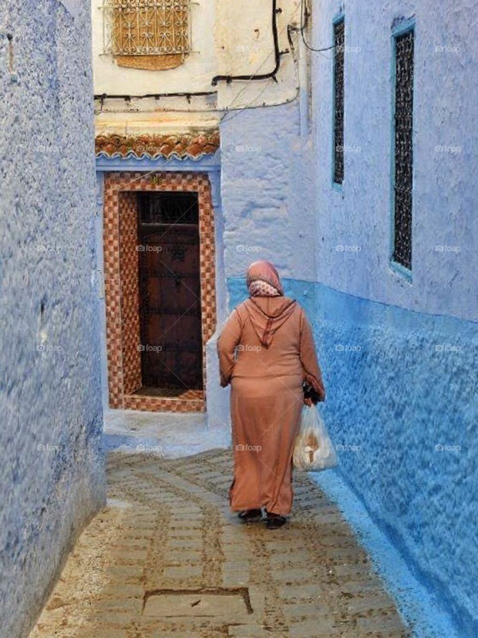 Woman in blue alley