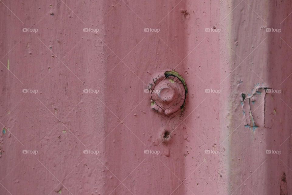 Pink fence with screw