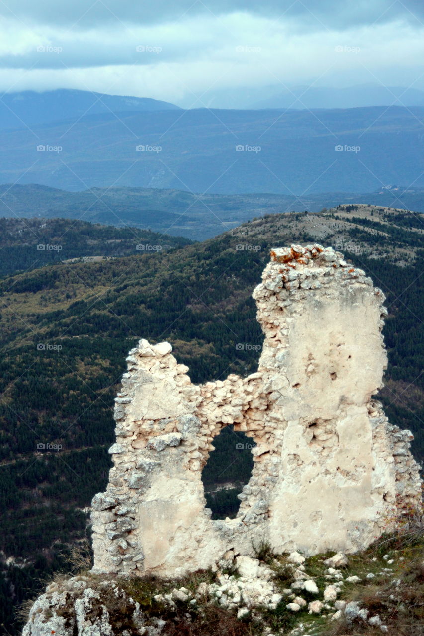 mountain landscape with broken ancient wall