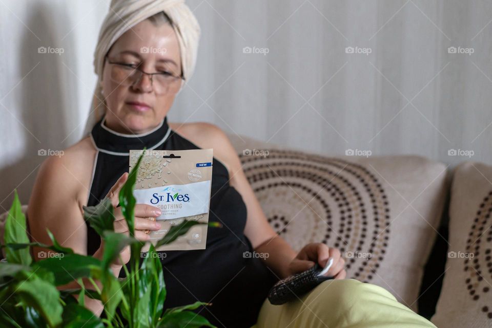 Home beauty salon woman making face mask