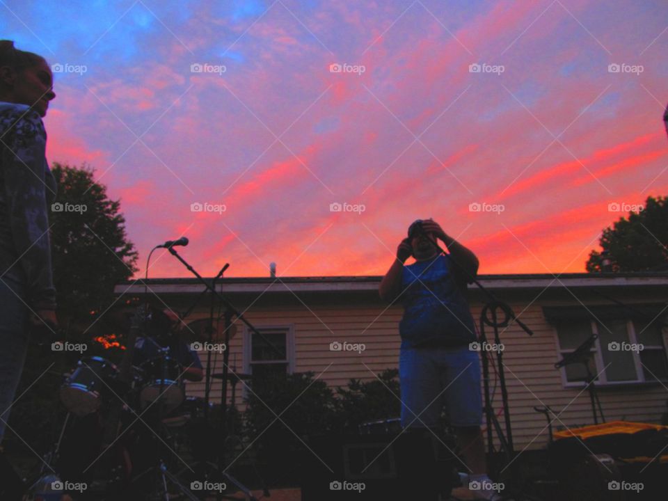 Red sky behind my band setting up