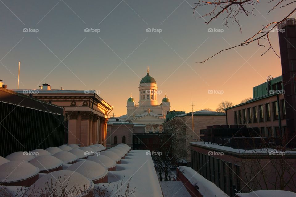 Helsinki Cathedral and the Finnish National Archives
. Helsinki Cathedral and the National Archives of Finland at the time of sunset with lots of snow on the ground
