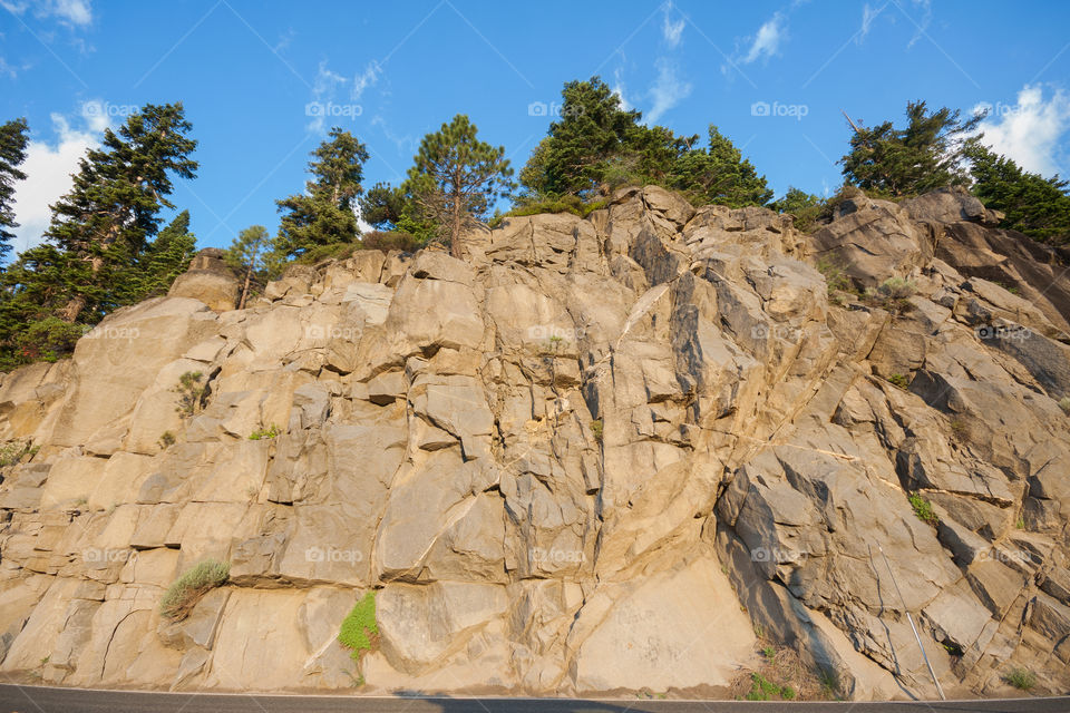 Side of a rough mountain near the road 