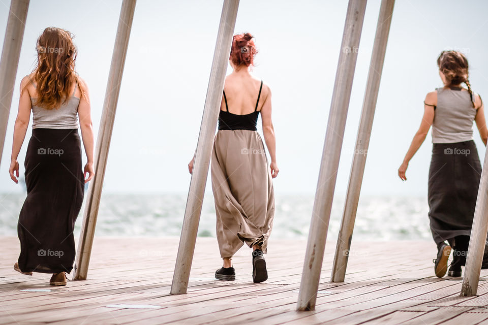 Rear woman dancing on deck