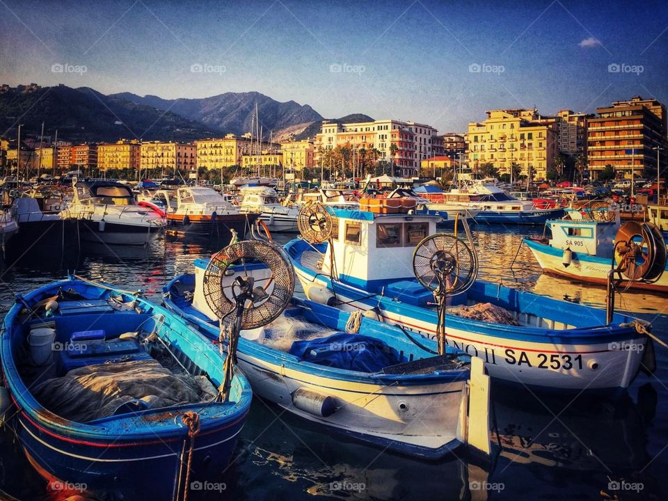 Fishing boats in harbor in Salerno, Italy