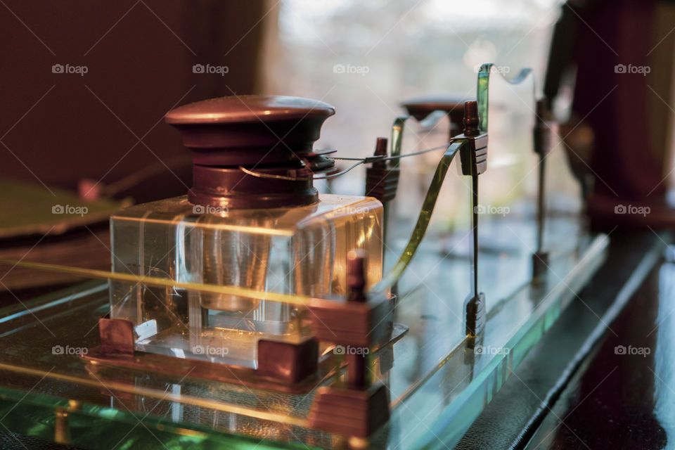 Flasks and ancient scientific objects in a laboratory.