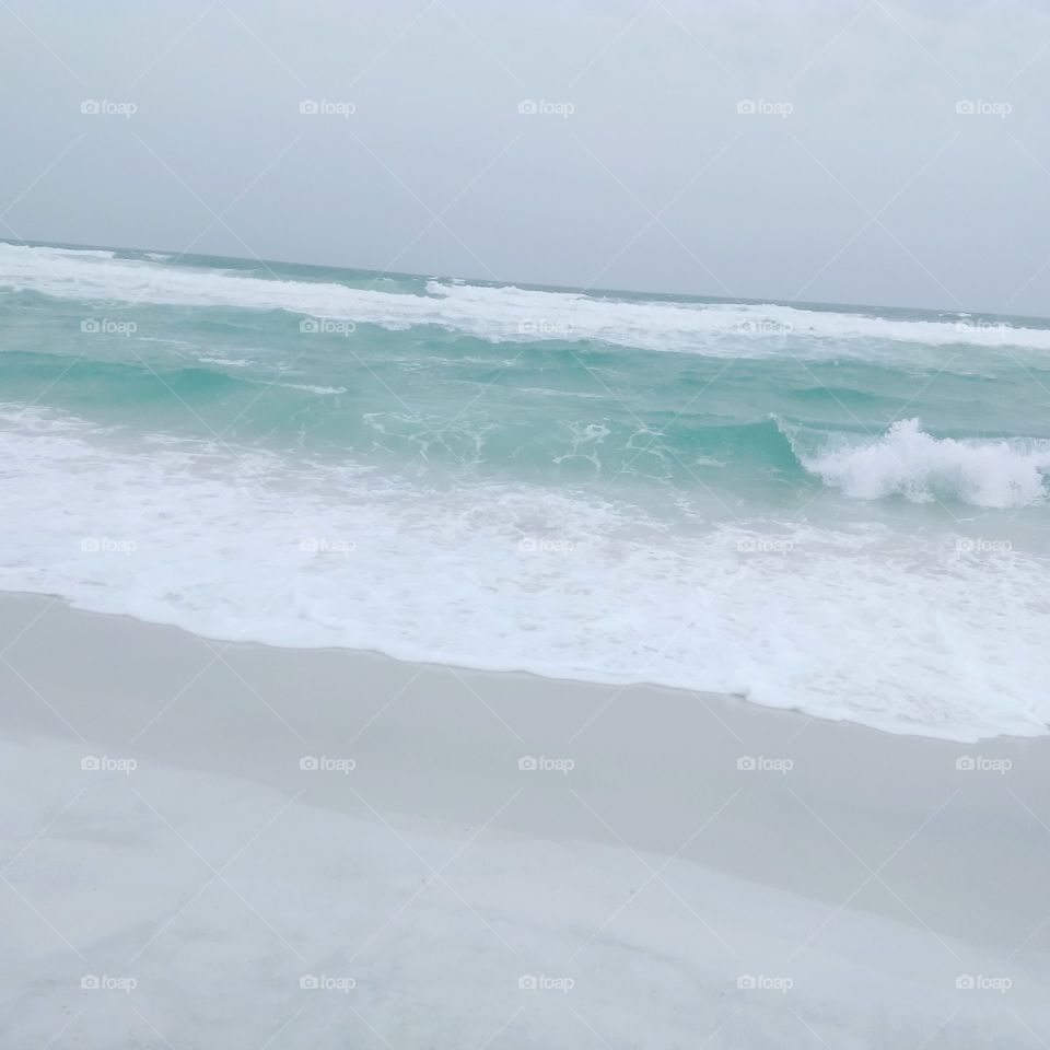 blue water and white sand
