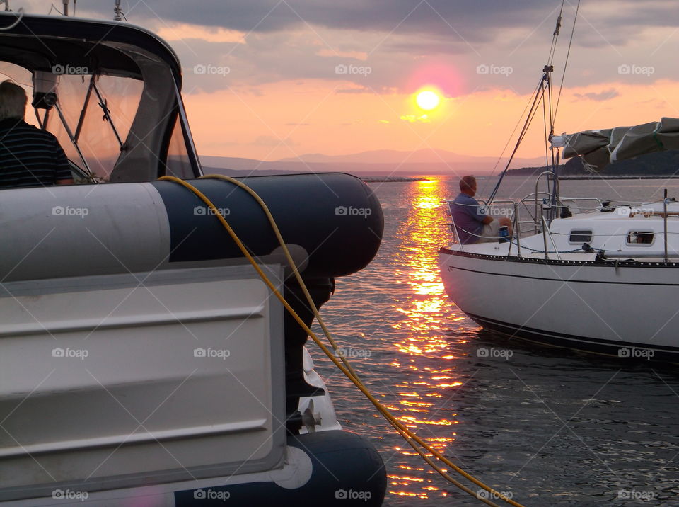 sailors watch the sunset. on Lake Champlain