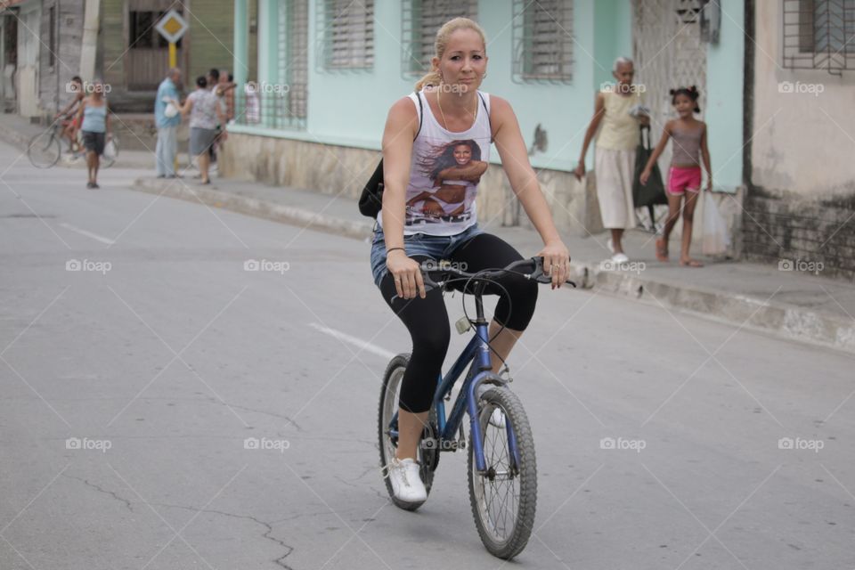 People In Cuba.Girl On Bike