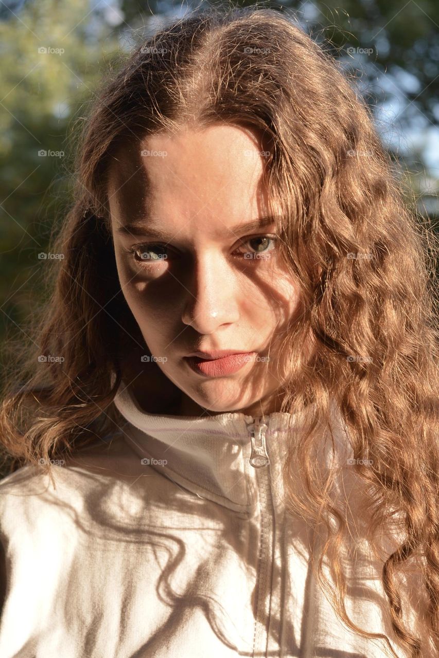 young girl beautiful portrait in sunlight