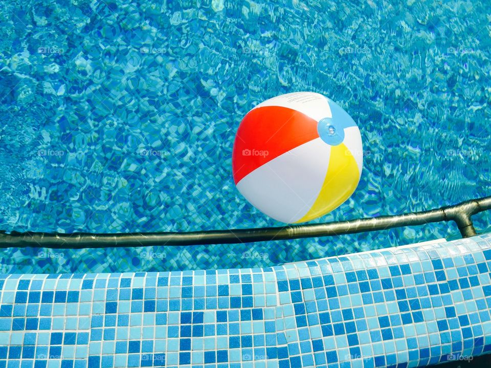 Multicoloured Water ball in the pool