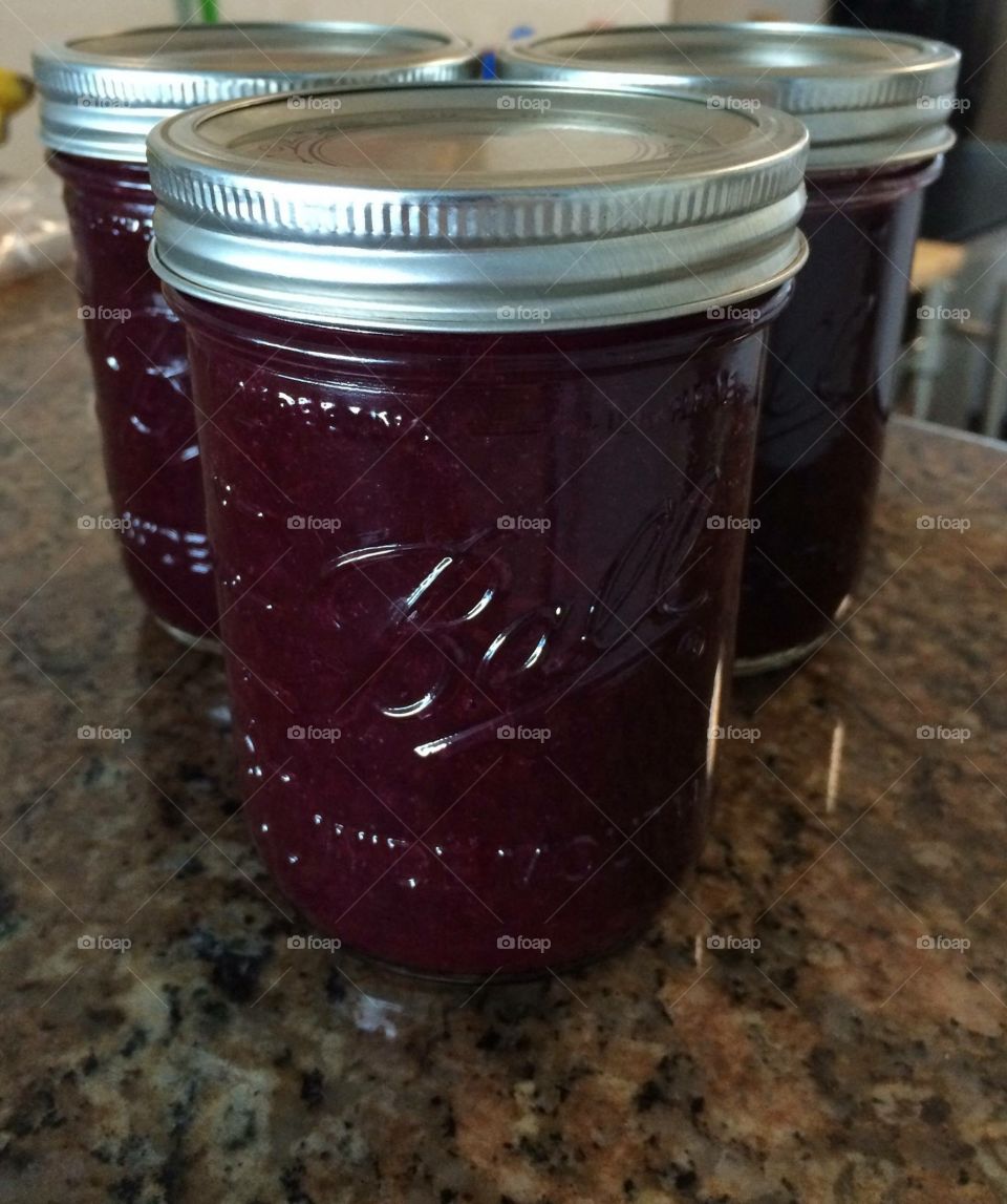 Blueberry jam in a mason jar.