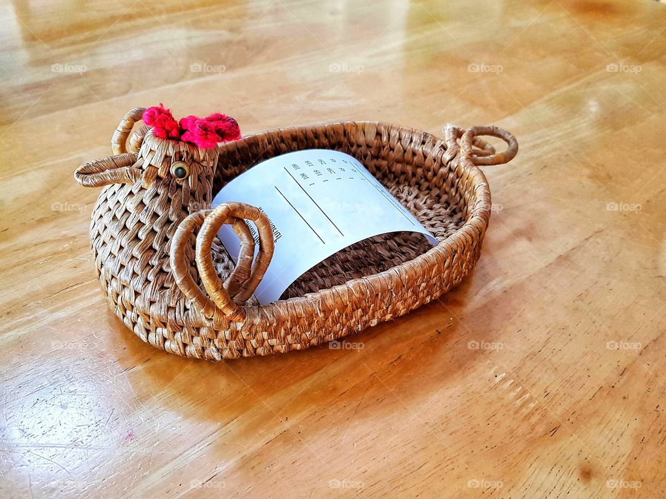 Bill in the chicken basket. It is handmade by rattan weaving.