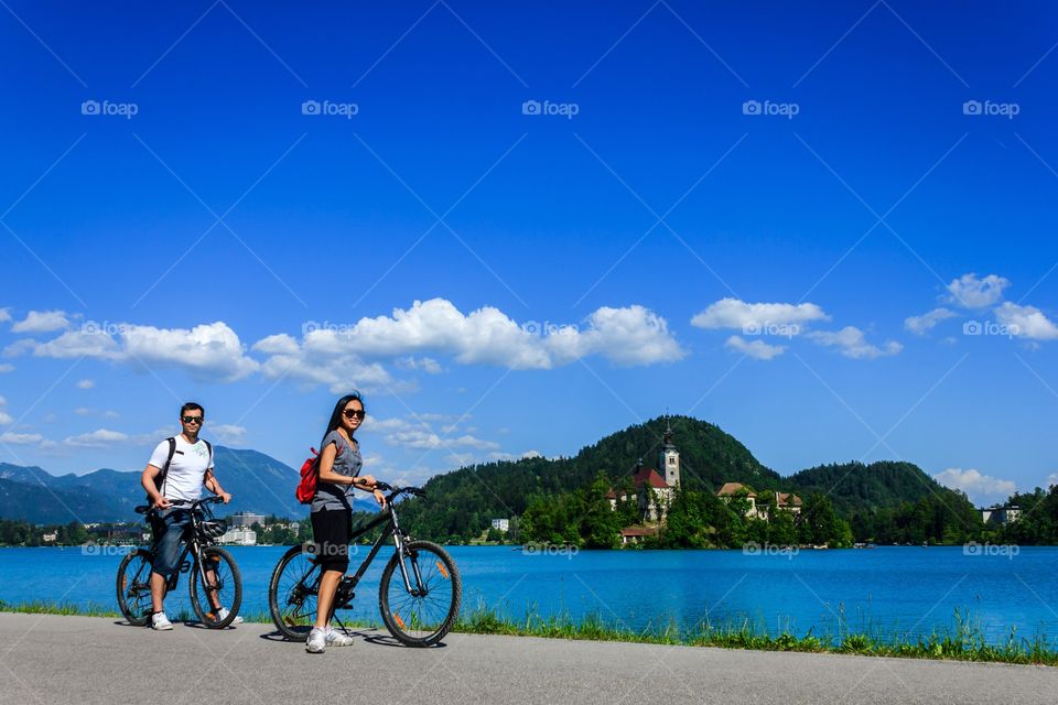 Biking around the lake on a nice sunny day.. Biking together around lake bled on a nice sunny day in summer time.