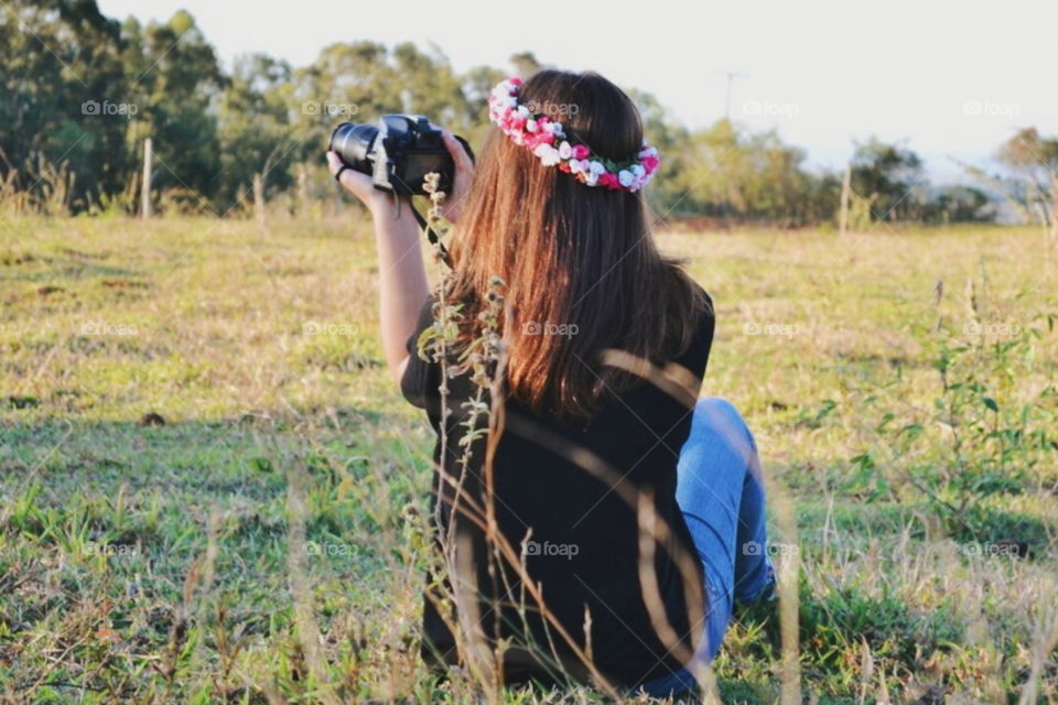 Girl photographing a landscape