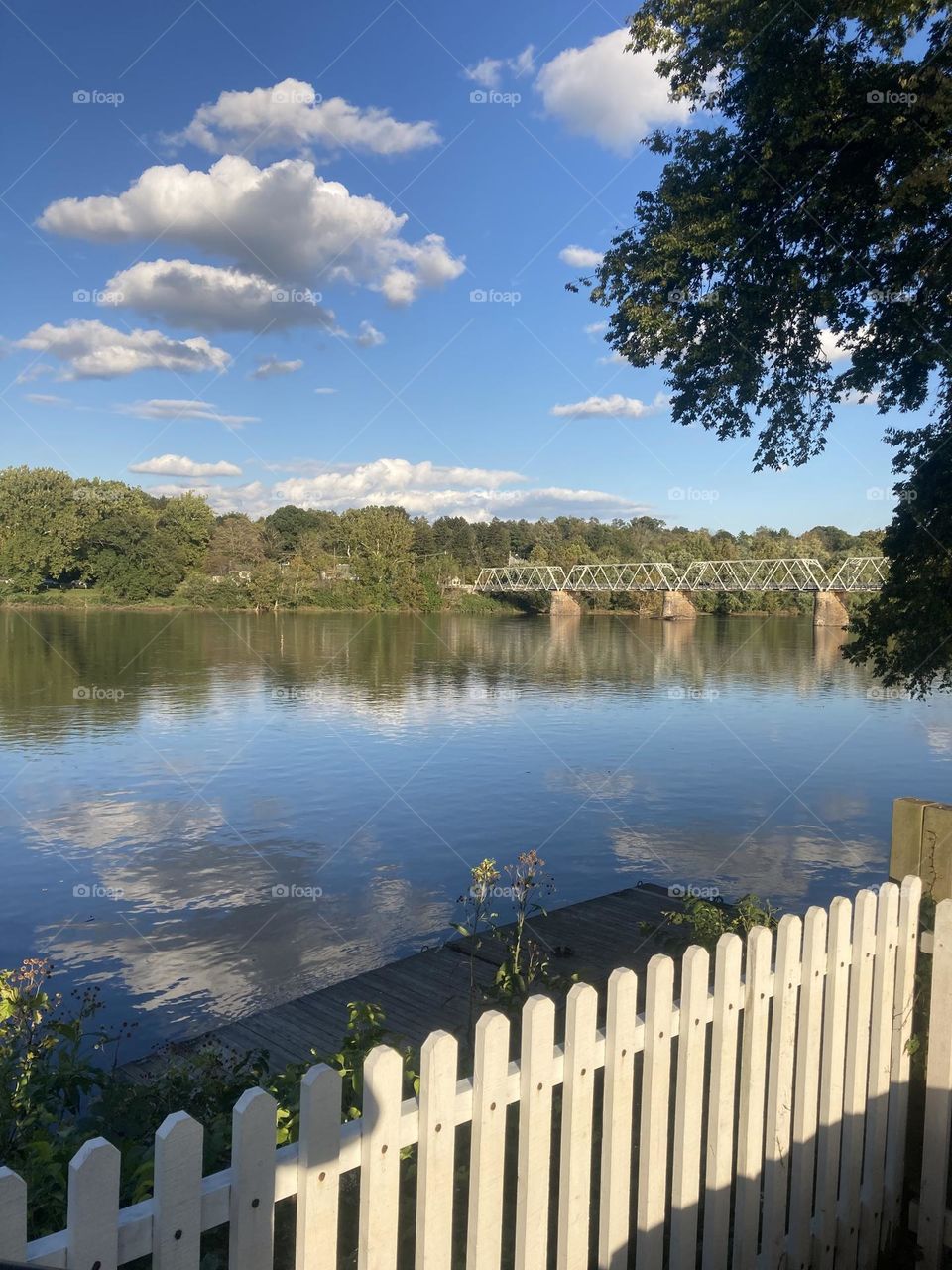 Tranquil Delaware River gently flowing beneath a bridge in Washington Crossing,PA looking towards New Jersey. 