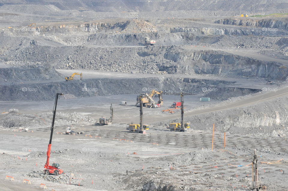 Drills at work at open pit gold mine