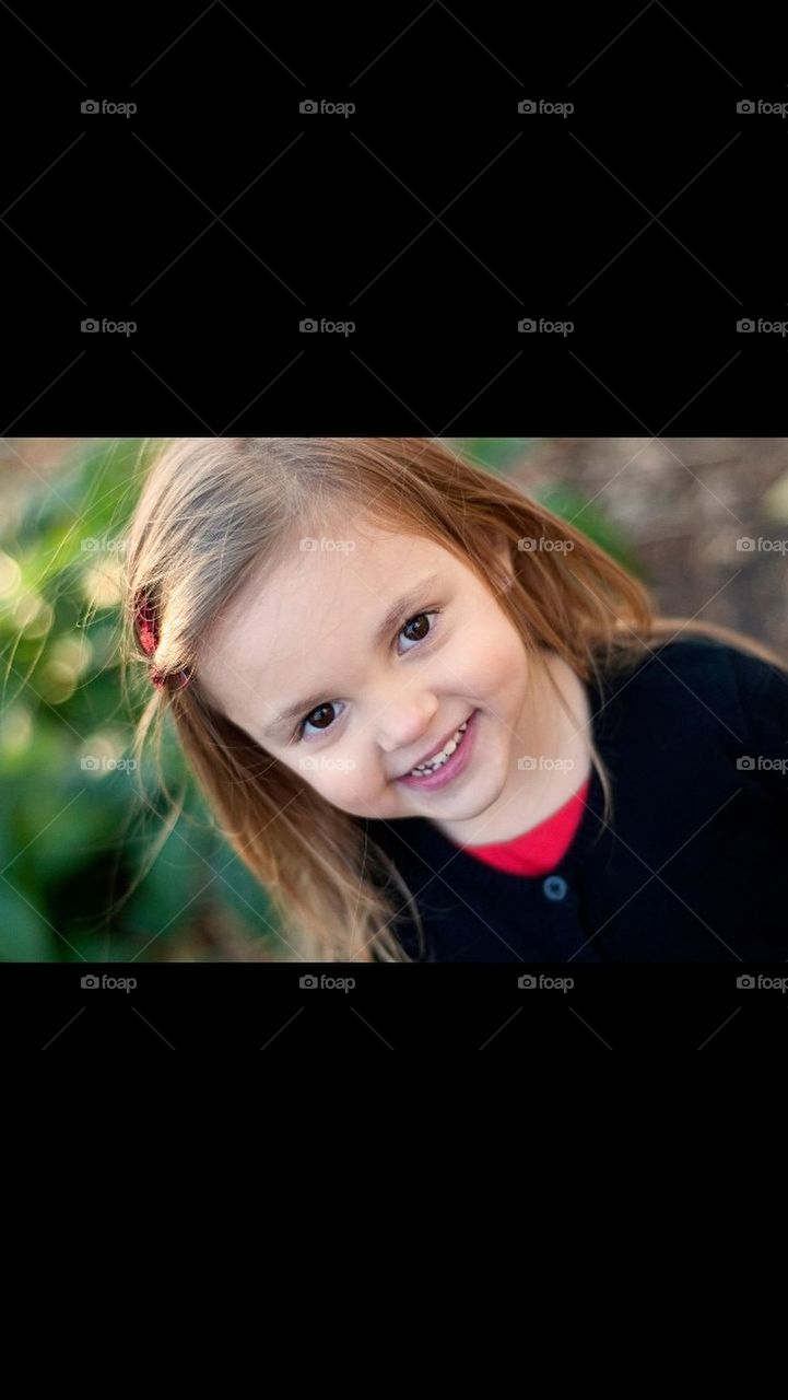 Little Girl Smiling Outside