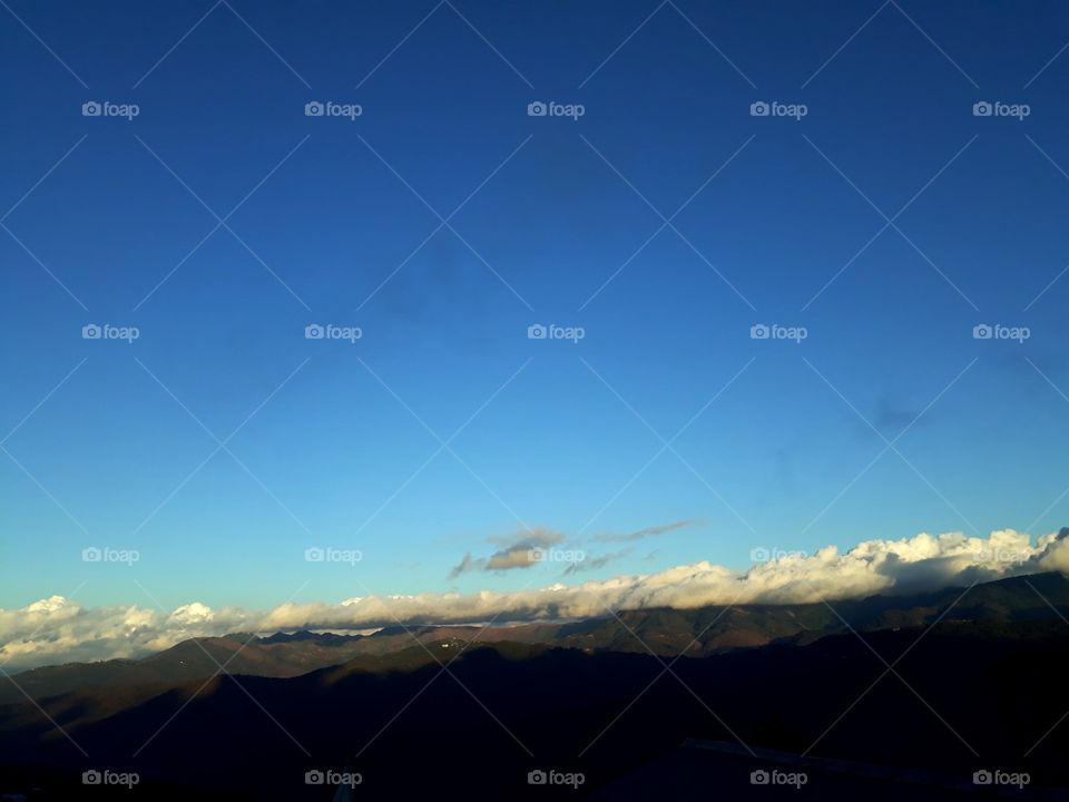 Beautiful mountain range, where you can see the sunshine and sunshade under the blue sky. 
Ukhrul, Manipur, India