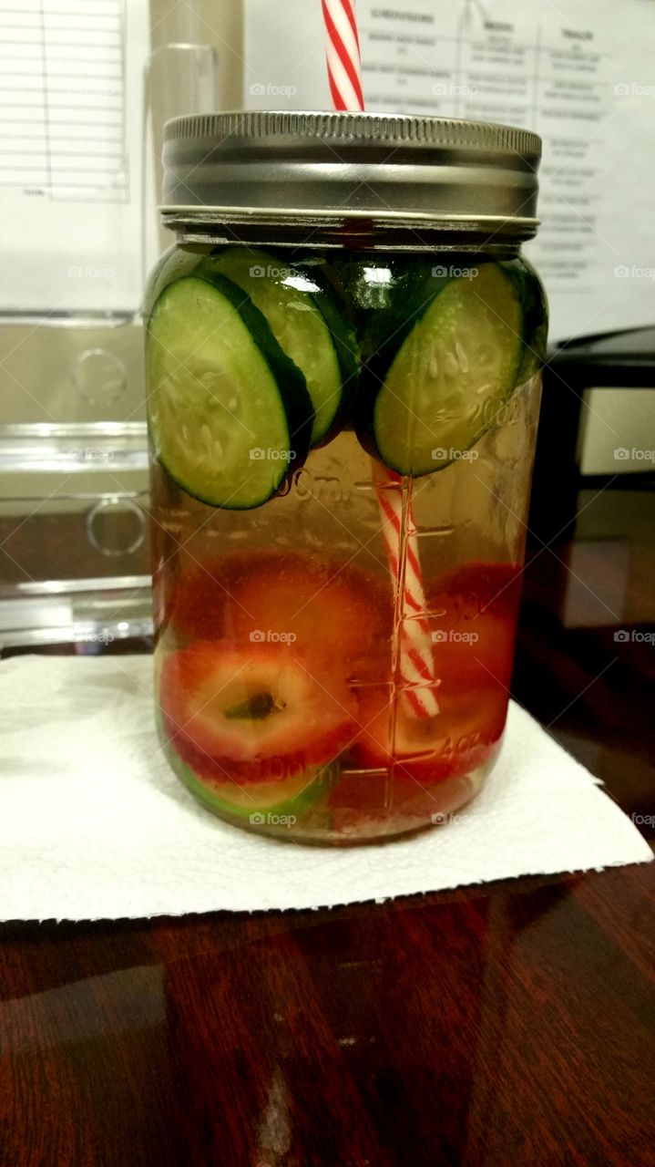 Detox water is so good for you! This mix is very colorful with the strawberries, cucumber and limes. Yummy yummy in my tummy!