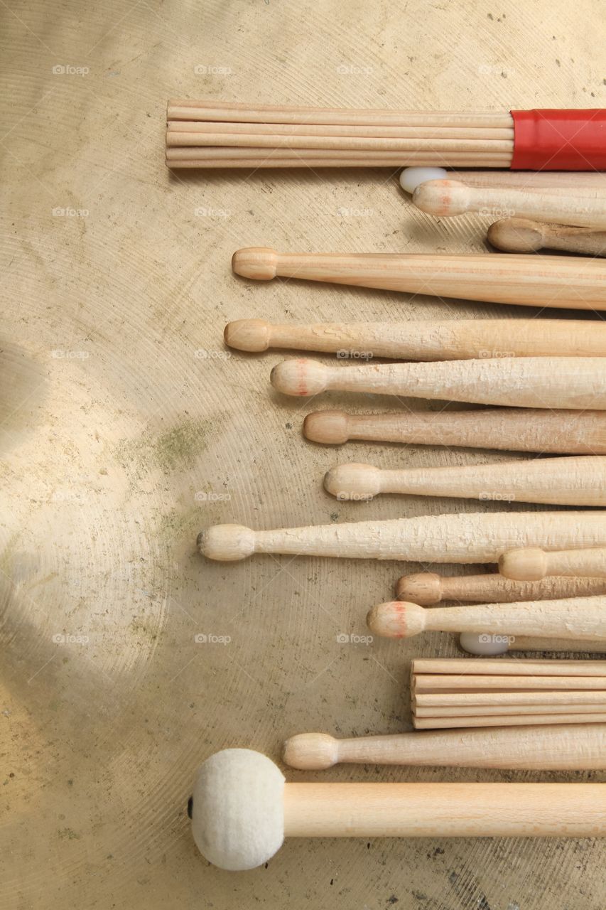 Various drumsticks on a cymbal