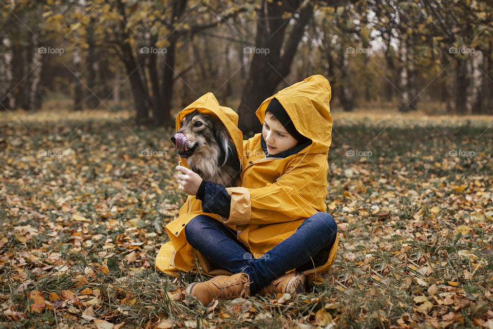 boy with a dog on a walk