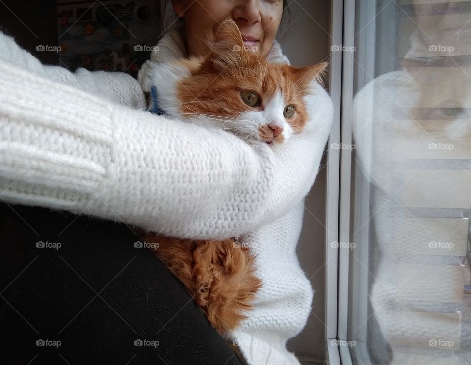 selfie girl with cat pet in the sweater