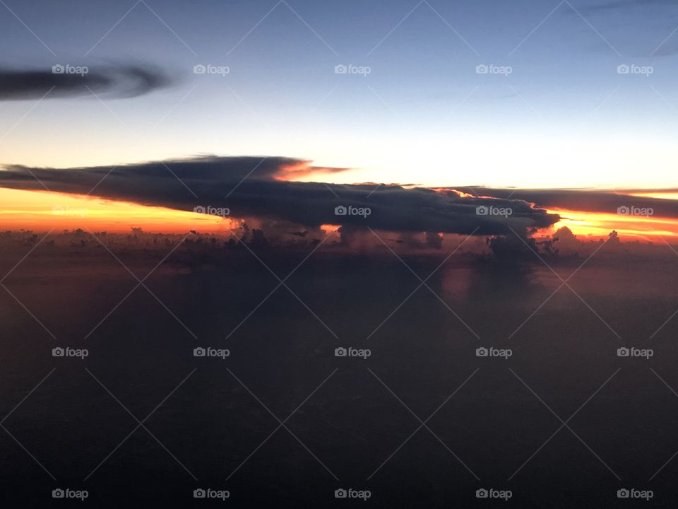 Rain clouds over the ocean with sunset