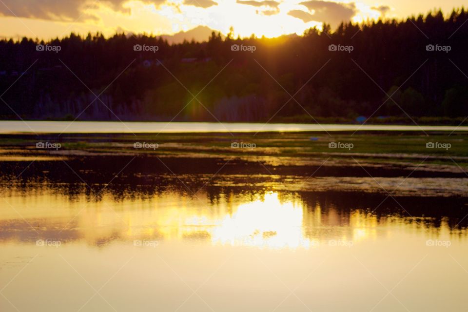 Hood Canal Sunset. Sun setting over the Olympic Mountain range