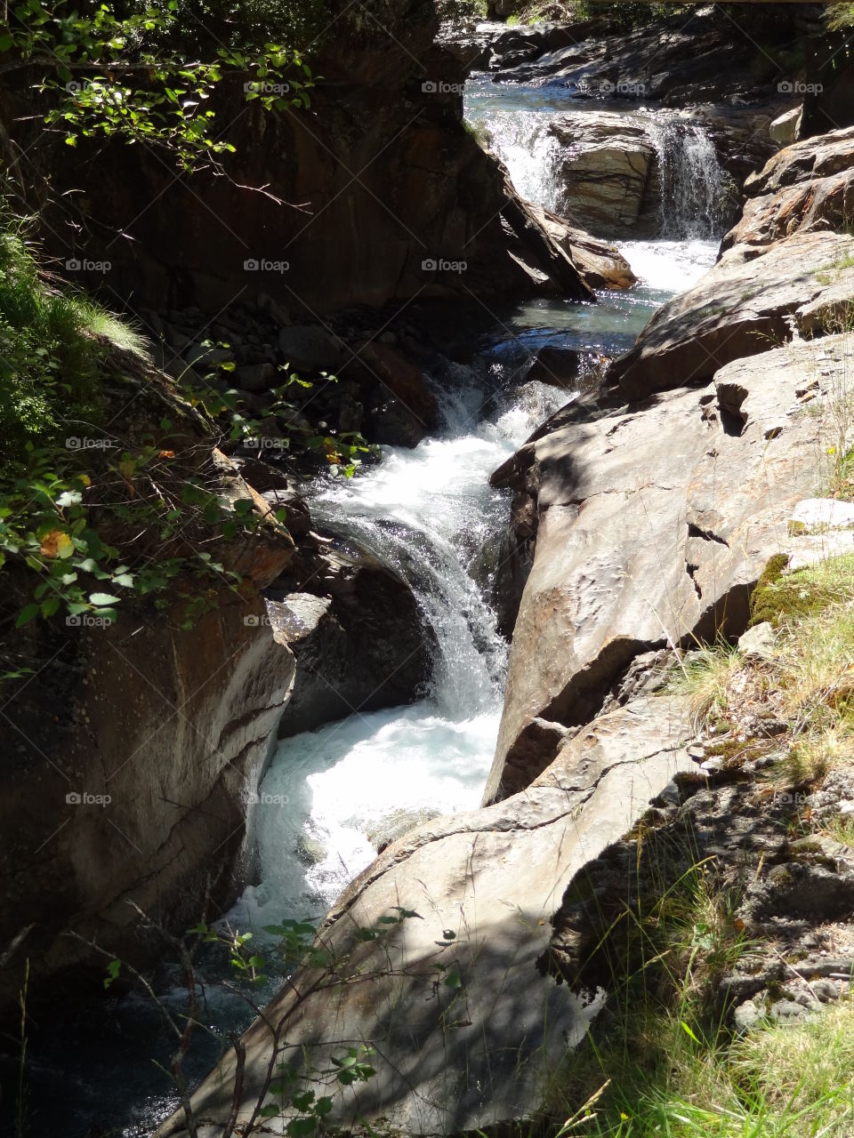 Rocky waterfall and pure water 