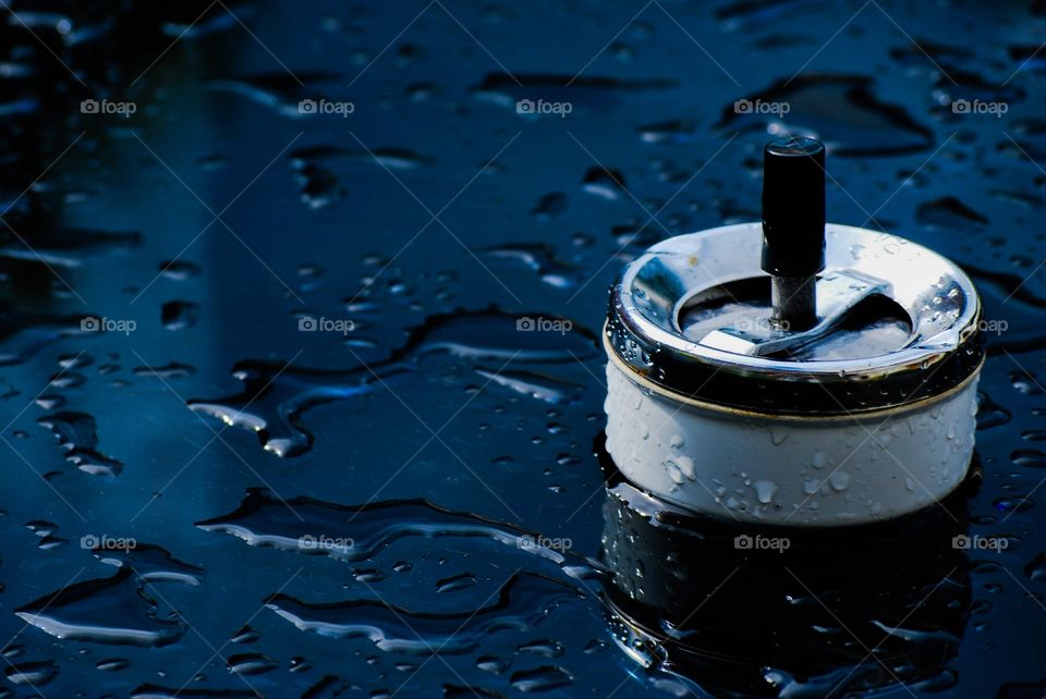 Ashtray on a wet table