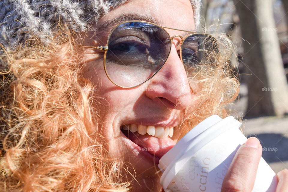 Beautiful Happy Smiling Blonde Young Woman Drinking Coffee In The Street
