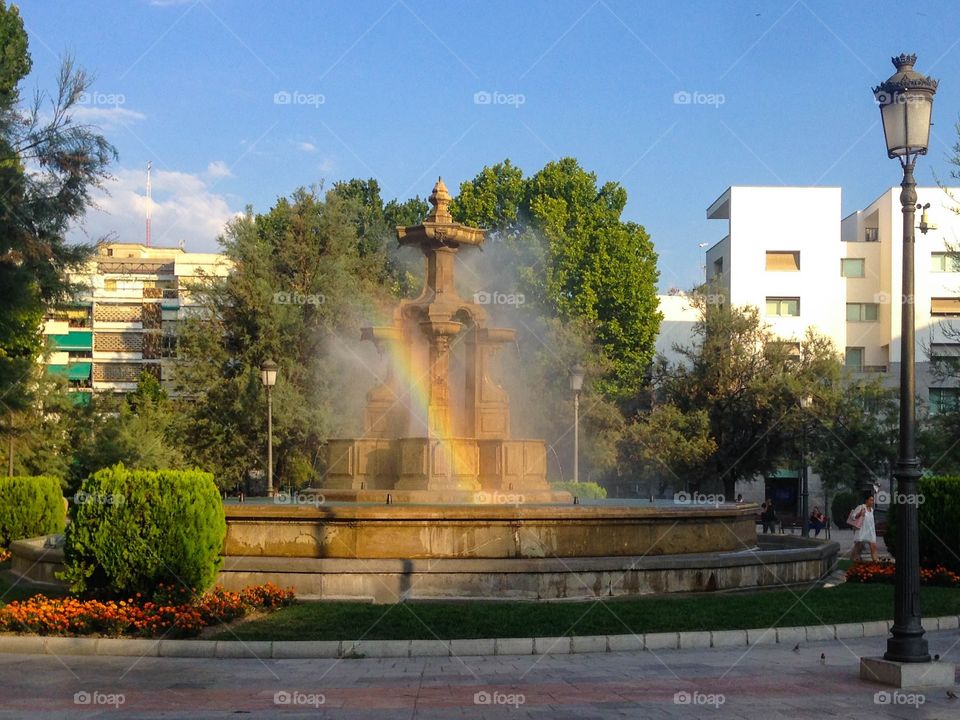 Fountains and sunlight = rainbow
