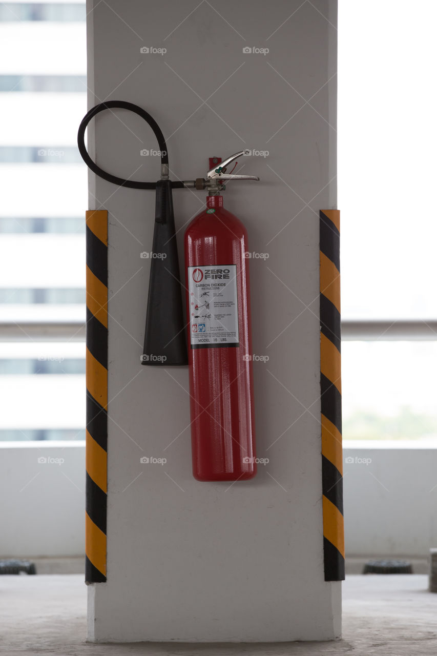 Fire extinguisher on the pole 