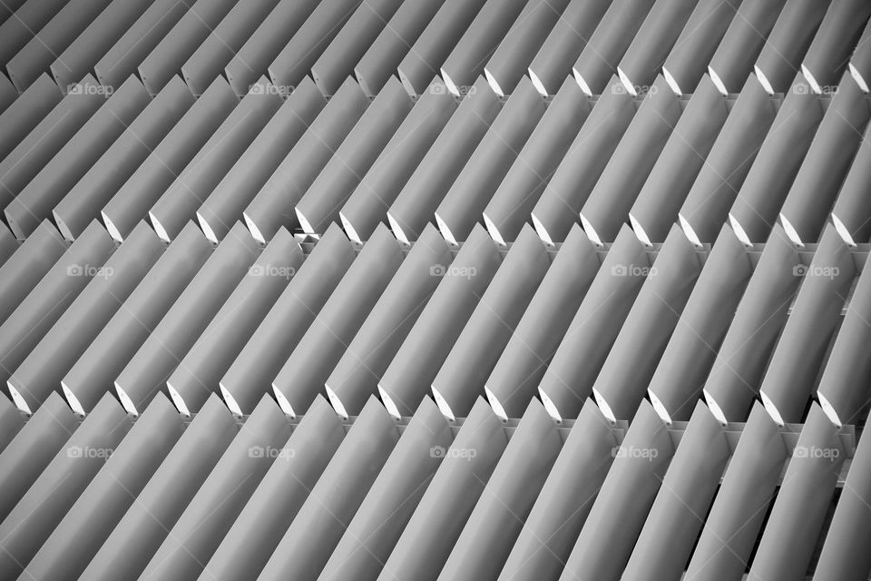 monochrome photo of automated ventilation blinds on rooftop of building. Used to regulate temperature.