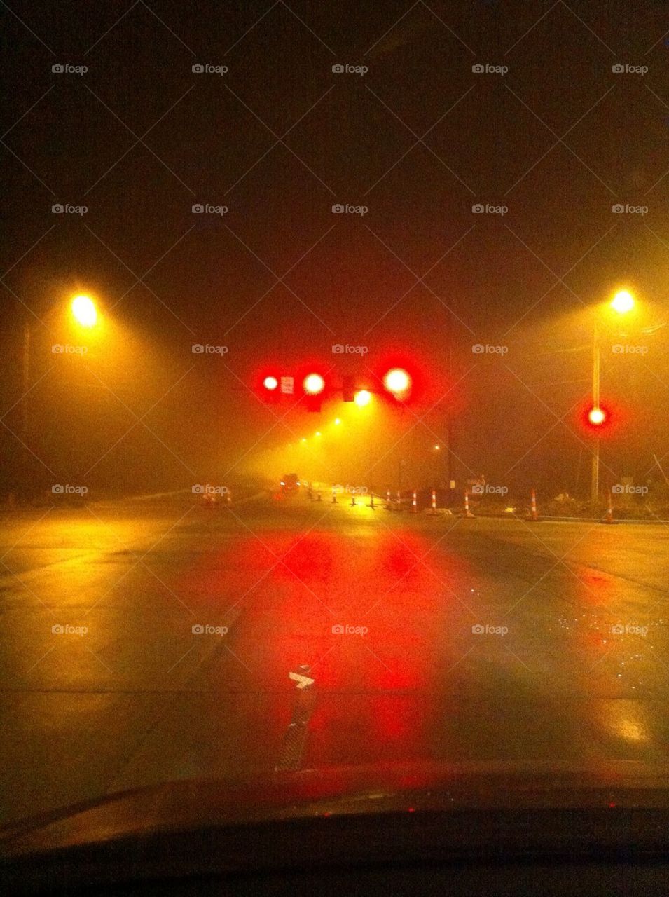 Foggy night at the stop light.