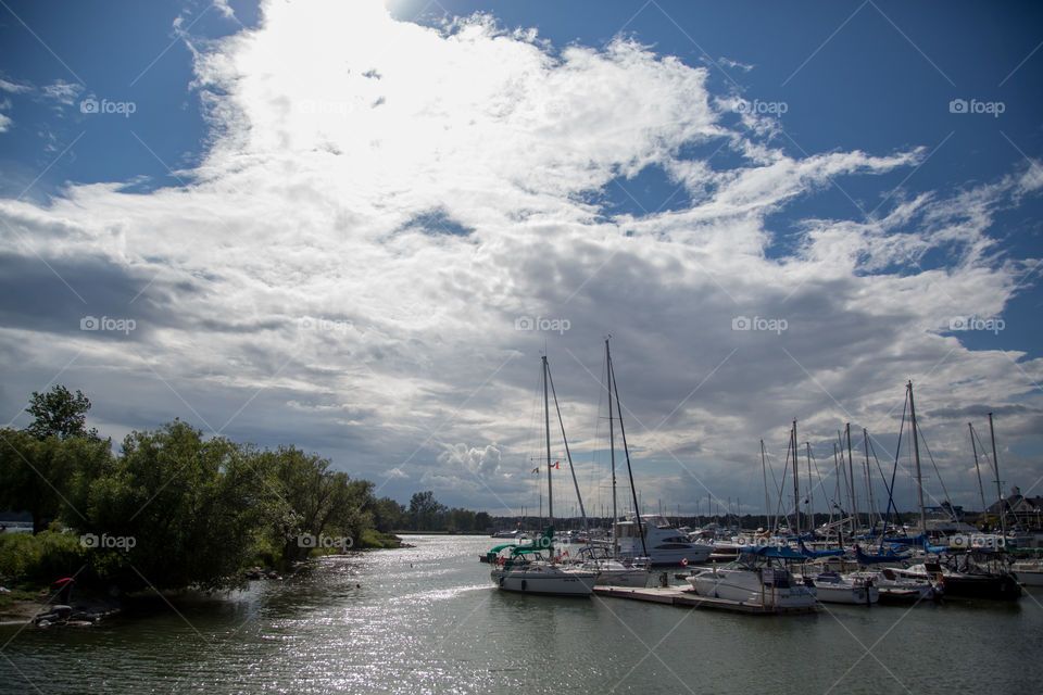 Storm over a harbour, low and large