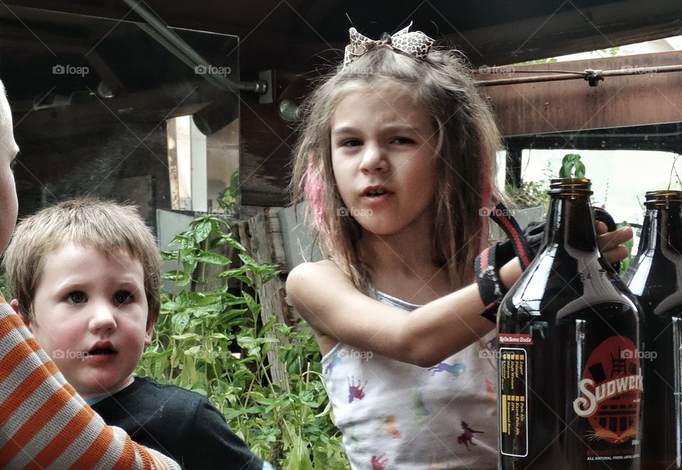 Brother And Sister Play Time. Young Brother And Sister Playing In A Rusty Old Car
