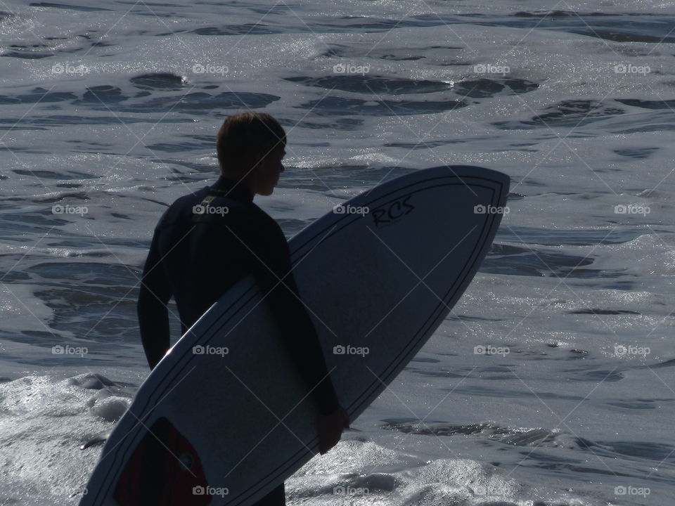 Silhouette of surfer and board