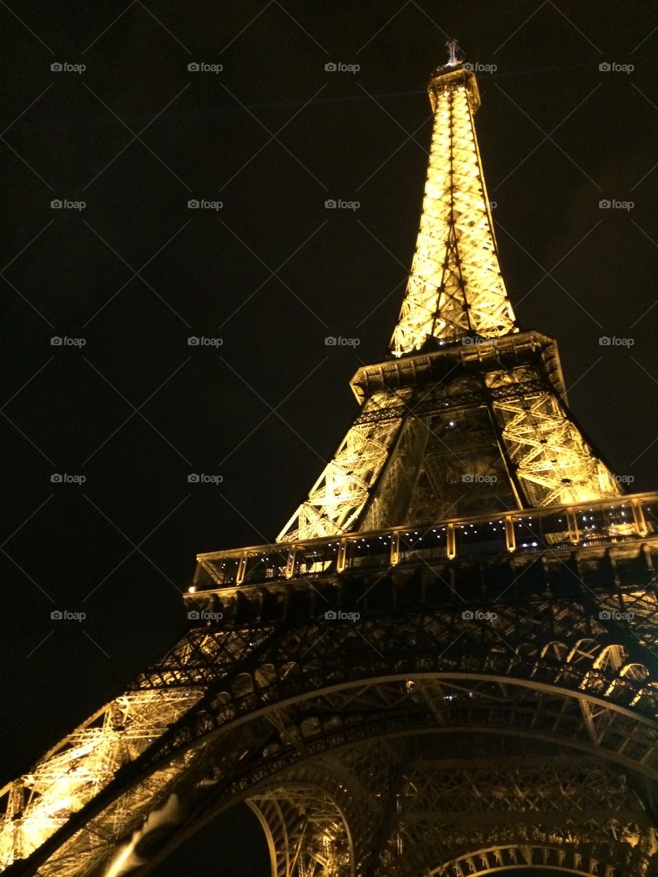 The Eiffel Tower lit up at night 