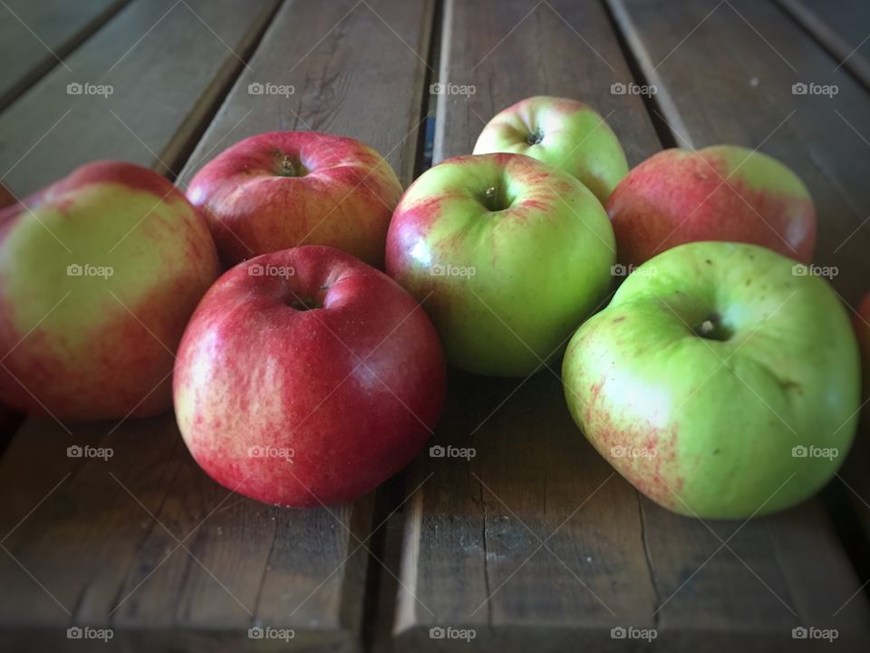 Autumn apples on wood