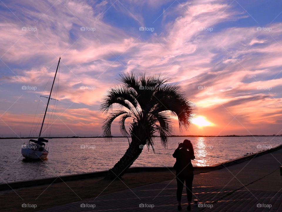 Gorgeous orange, pink, mauve and blue hues backdrops leave spectators in awe as the sun makes its way toward the horizon.