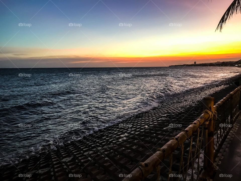 Sunset on the sea , I love looking at the colors of the sunset , I sat at a beachside restaurant and enjoy it