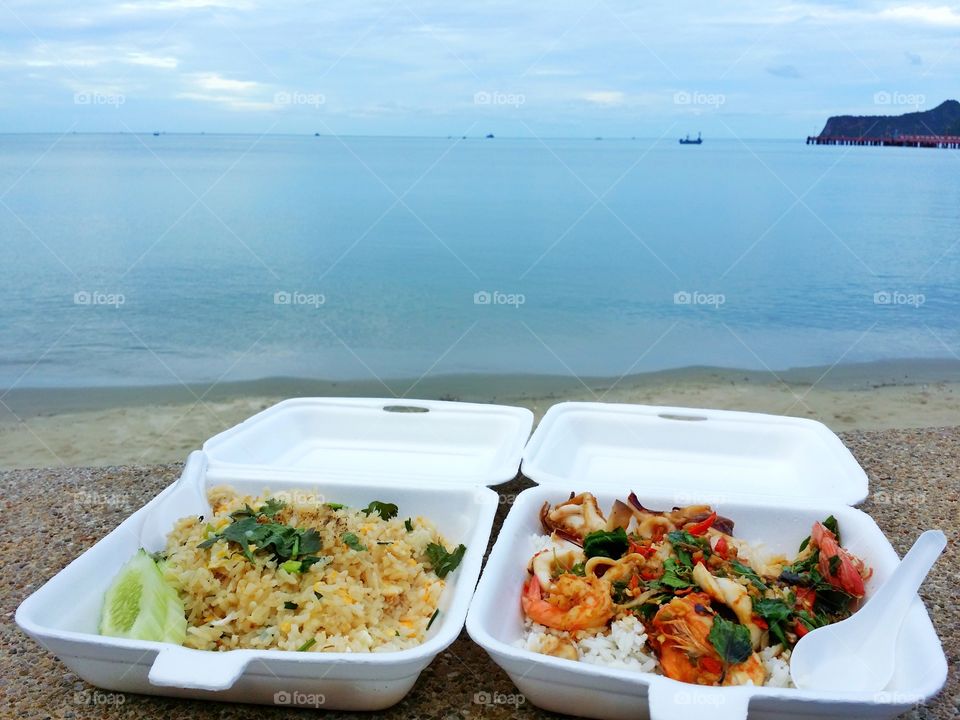 Fried rice crab, fried rice squid and shrimp and sea beach evening.