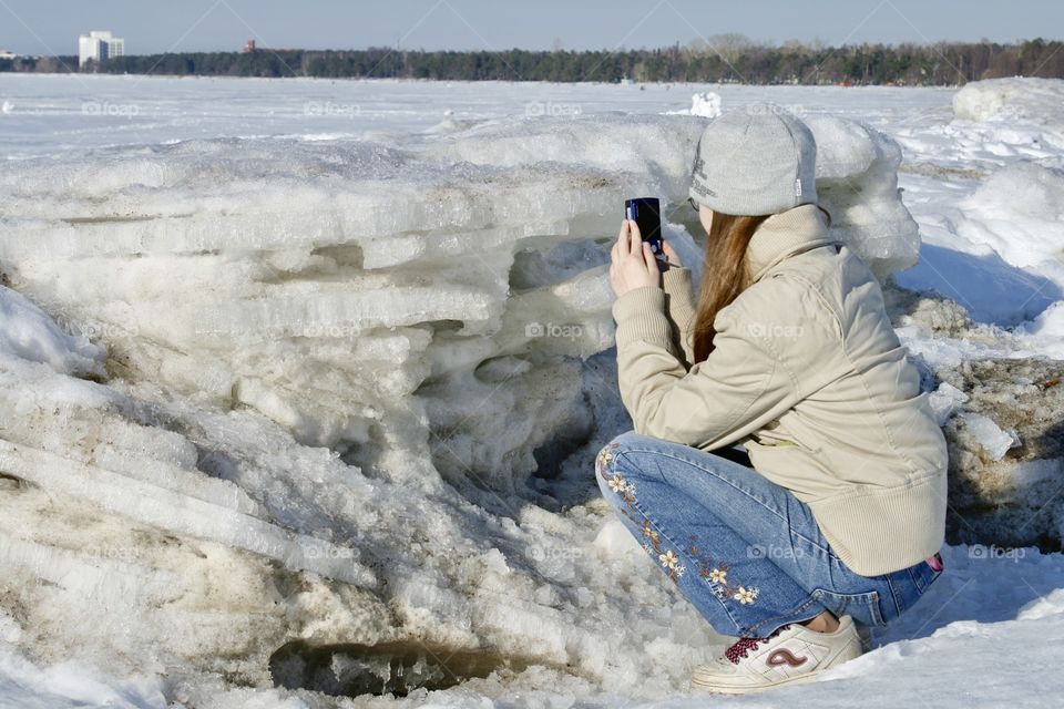 Girl taking pictures. Winter