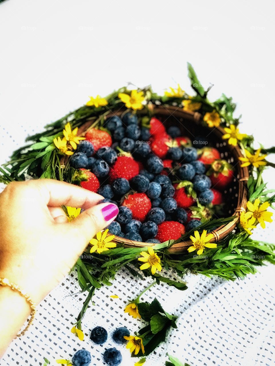 Strawberry and blue berry with yellow flower 