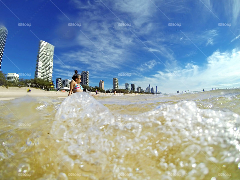 girl Swimming in Gold Coast beach in Queensland, Australia