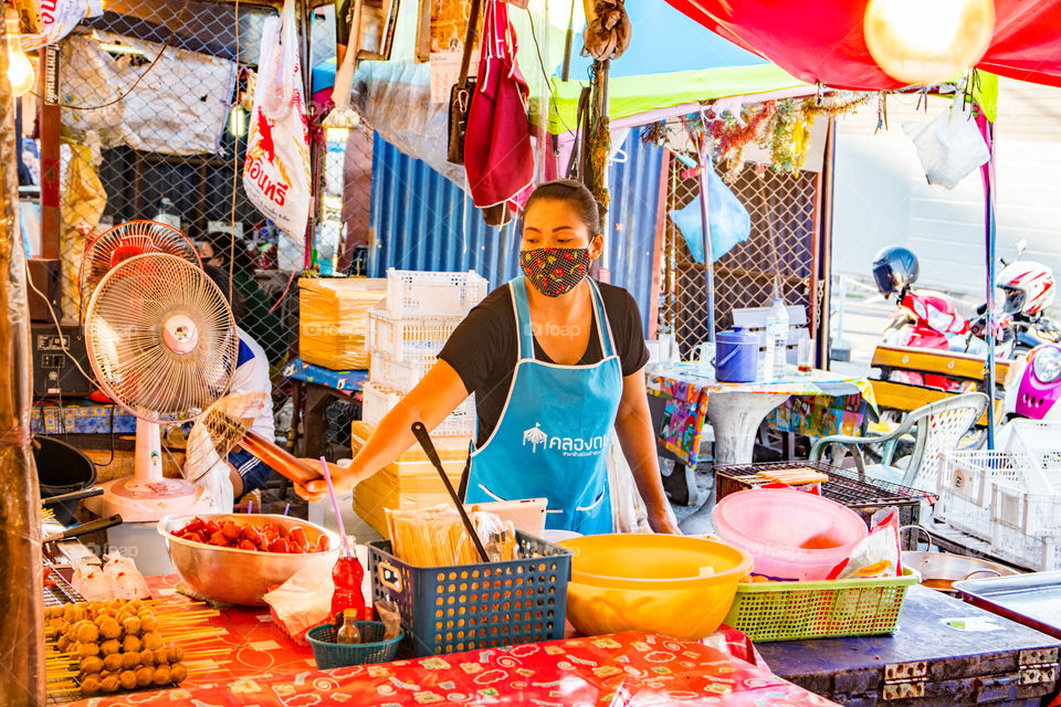a thai  Woman work at a Street food market in Pattaya District Chonburi Thailand Southeast Asia during the Covid 19 Timeline